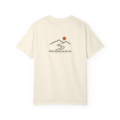Back view of the Ivory Unscheduled Miles Road Tee with its compact ridge, winding road and orange sun graphic.